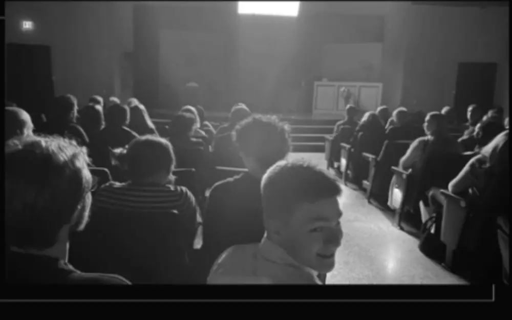 Audience members gathering before a theatre performance